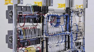 The reverse side of the electrical switchboard. The connected wires are tied with plastic ties.