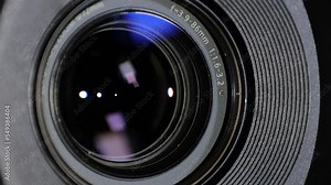 Close up of Camera Lens with Flare on Optical Glass. Process of Zooming Camera Lens