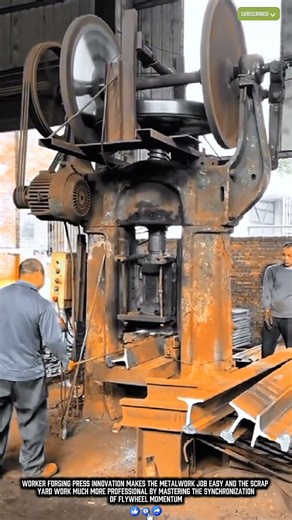 Worker breaking steel scraps with a high-pressure forging press for efficient recycling