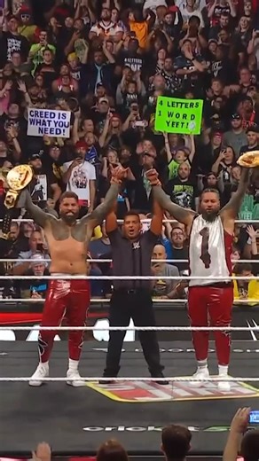 WWE on Instagram: "THE USOS GET IT DONE 🏆 @uceyjucey & @jonathanfatu are your NEW WORLD TAG TEAM CHAMPS!! #WWERaw"