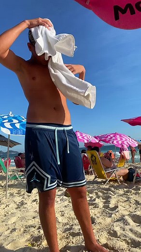 A Relaxing Day at the Beach: Young Male Enjoys Sunshine