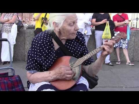 Babushka playing her domra in St. Petersburg, Russia