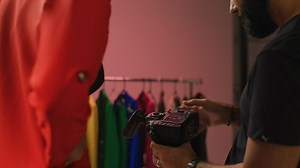 Model and photographer look at photos from a photoshoot - Free Stock Video