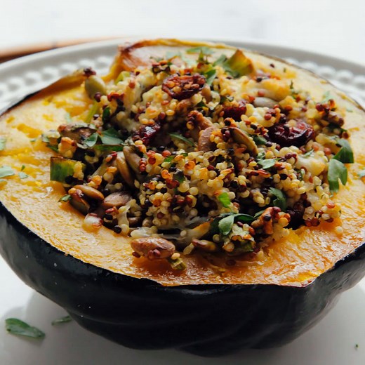 This vegetarian stuffed acorn squash recipe is beautiful and delicious! 👏Roasted acorn squash halves topped with herbed quinoa make a delicious holiday-worthy main dish. This recipe is simple enough to put together on a relaxed weeknight, too. 🙋🏻‍♀️✨️ Vegetarian Stuffed Acorn Squash recipe on the blog! https://cookieandkate.com/vegetarian-stuffed-acorn-squash-recipe/ | Cookie and Kate