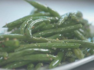 Patti amps up her sauteed string beans with an all-star ingredient. Make this recipe: http://www.cooktv.com/5ulol. | Cooking Channel