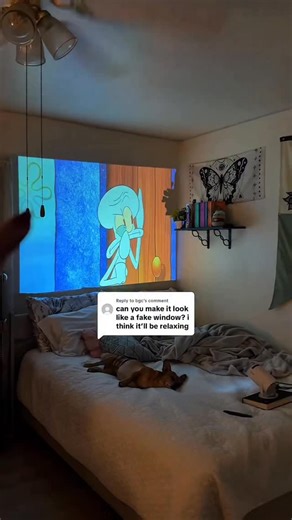 @plugandproject on Instagram: "lowkey… a fake window actually makes the room feel way more relaxing 😭🌙 ~ follow for more cozy room inspo ✨ ~ #projectorlife #cozynights #roomsetup #viraltech #aestheticroom #movienightvibes #techfinds #bedroominspo #homedecorideas #giftideas #smallspaceliving"