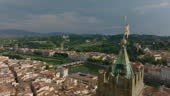 Tight fly around tall stone tower of historic Palazzo Vecchio high...