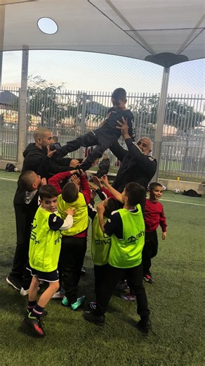 Children's Soccer Team Cheer at Outdoor Practice