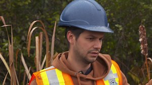 While excavating the eastern border of the swamp, the team uncovers a massive iron ring bolt that’s severely burned. | The Curse of Oak Island
