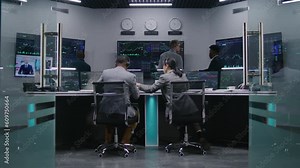 Multi ethnic team of traders work on multi-monitor computers with displayed real-time stocks. Colleagues analyze exchange market charts on big screens. Cryptocurrency trading and investment concept.