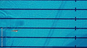 Man Swimming in Pool Without a Shirt On