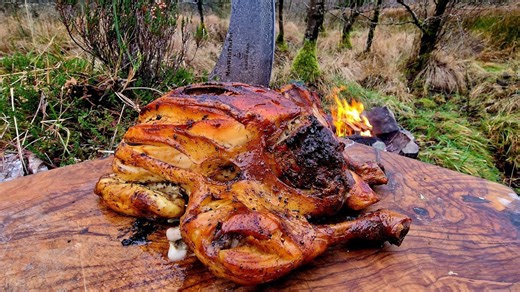 Watch how this rotisserie chicken turns perfect over open fire