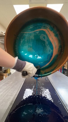 Scraping the copper pot after pouring the blue hard candy | Hercules Candy Co