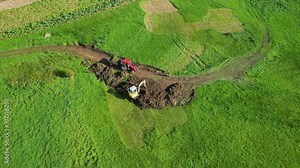 View from Above Of Backhoe Scooping Soil On The Field. Zas, A Coruna, Spain. aerial shot Stock Video