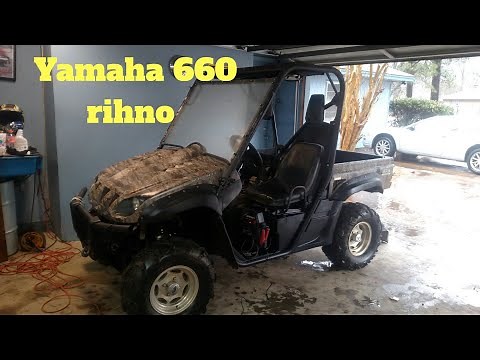 How to replace Yamaha Rhino 660 rear wheel bearings , studs , lug nuts and cooling fan.