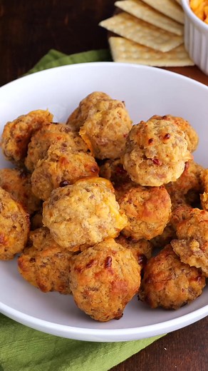 Full Recipe: https://buff.ly/vabPS6A Pimento Cheese Sausage Balls – this recipe will change the way you make sausage ball forever! Seriously THE BEST sausage balls EVER! Only 4 ingredients – sausage, cream cheese, Bisquick, and pimento cheese. Can make in advance & freeze for a quick snack later. Great for parties, potlucks, tailgating, and dinner! | Plain Chicken