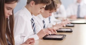 4k, Teenage school children with digital tablets in classroom
