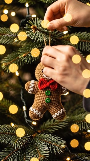 This adorable crochet gingerbread man ornament brings the perfect cozy touch to your holiday decor. With a bright red bow tie, sweet embroidered details, and classic gingerbread charm, it’s ideal for decorating your Christmas tree or gifting to someone special. A festive handmade piece that fits beautifully in any holiday setup! #ChristmasCrochet #CrochetOrnament #GingerbreadCrochet #HolidayDIY #HandmadeChristmas | Theworldcrochet