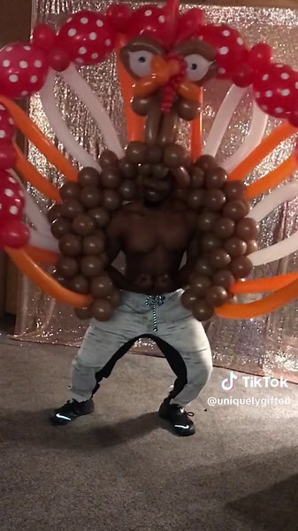 My son in a turkey balloon costume HAPPY THANKSGIVING lol