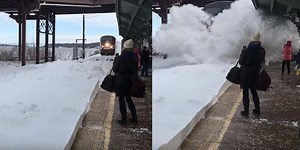 Incredible video captures the moment when a train splashed tons of snow over unsuspecting passengers
