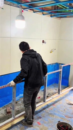 Installing metal frame structure during room renovation work