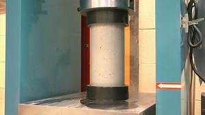 clip-7887058-testing-concrete-cylinder-by-crushing-machine-measure