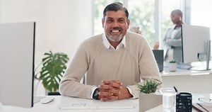 Happy, smile and face of businessman at computer for management, leadership and vision. Professional, executive and future with portrait of employee in digital agency for mindset, career or goal