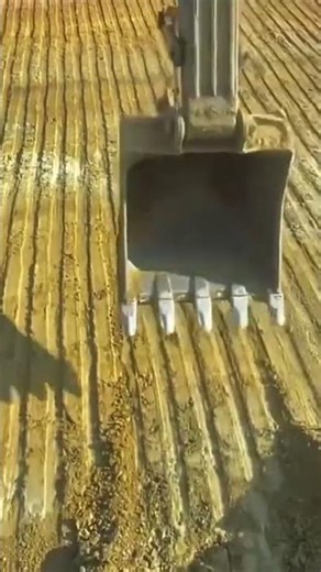 This is the process of scraping soil using a heavy equipment claw#shorts