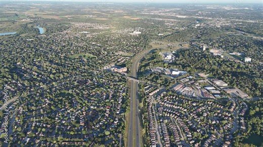 Aerial footage of the King's Highway 85 through the suburbs of Waterloo city in Ontario, Canada