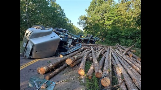 Log Truck Flips on Two-Lane Road