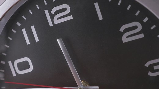 Close up of a clockface ticking quickly - Free Stock Video