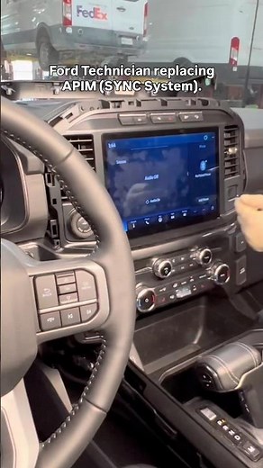 Ford Technician replacing APIM (SYNC System).