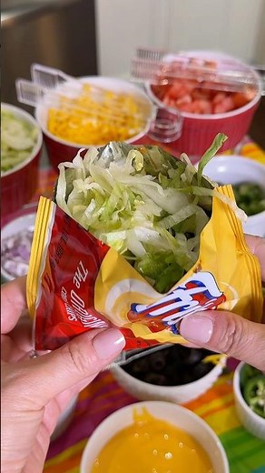 Walking taco bar set up with crock pot taco meat for a party