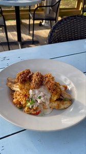 Seafod stuffed Red Snapper topped with Beurre Blanc and Cornmeal Fried Oysters over a decadent Crawfish, Crab Rice. | The Little Big Cup