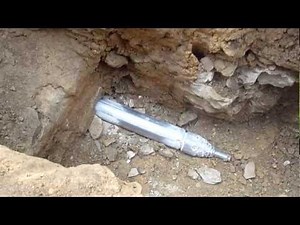 Impact moling through rock