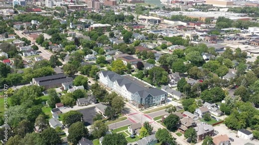 Green Bay, Wisconsin neighborhood flyover featuring apartment building, houses and tree-lined streets