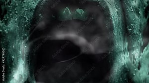Ghostly face with an open mouth screaming in the darkness. Spooky Halloween themed design or mysterious horror themed project