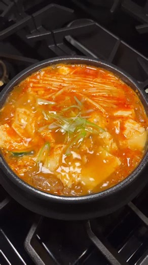 Madeline on Instagram: "BCD tofu soup @ home!! Never not craving this 😮‍💨😮‍💨 - sesame oil - kimchi - beef rolls - garlic - green onion - yellow onion - zucchini - mushroom - bone broth - glass noodle - BCD soup kit (sauce & tofu) - fish sauce - egg #tofu #soup #koreanfood #easyrecipe #cookwithme"