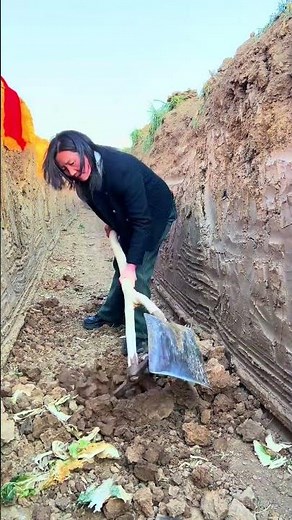 The process of digging a trench with a shovel and hoe