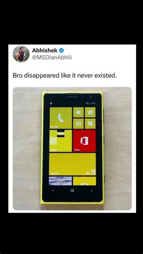 Johnny Bravo Explains Memes on Instagram: "Hey everyone, Johnny here to explain. This meme is a nostalgic and humorous commentary on the now-defunct Windows Phone, which was Microsoft's attempt to enter the smartphone market with its own mobile operating system. The tweet by user MSDianAbhiii features a photo of a bright yellow Nokia Lumia — one of the most iconic Windows Phones — running the distinct tile-based Windows Phone OS. The caption, "Bro disappeared like it never existed," captures the