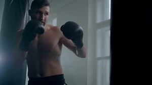 Man boxer training hard for a fight