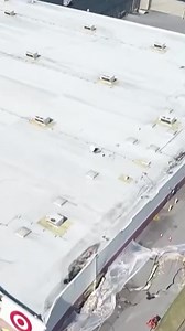 Aerial video shows a Target store in West Virginia breaking apart as a road collapses. Target is offering to cover relocation costs for residents who have to evacuate. | NBC Washington