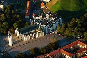 Aerial view of Vilnius Old Town, the capital of Lithuania. The main building in the center is Vilnius Cathedral, with its detached bell tower. Behind the cathedral is the Palace of the Grand Dukes of Lithuania, a reconstructed building that now serves as a museum and venue for state events. On the hill behind the palace, you can see the Tower of Gediminas a historical symbol of the city. | Walter Kavaliauskas