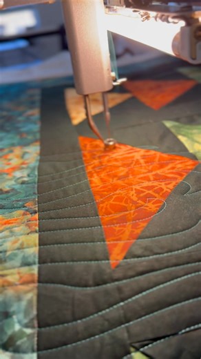 When Autumn Leaves Meet Modern Motion: The Mercury Pantograph ✨🍂 There's something magical about a fall leaves quilt panel. It captures a fleeting, perfect moment of autumn—the brilliant reds, golds, and oranges, the crisp air, the gentle decay. As a quilter, my job is to enhance that beauty, not overshadow it. When this stunning panel came into the studio, I knew the quilting needed to be equally special but with a modern, dynamic feel. Enter the Mercury Pantograph! For my non-quilting friends