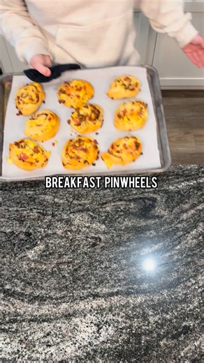 Cooking With Murph on Instagram: "Breakfast Pinwheels- A food item every family member of mine loves🙌🏼🥓🍳🧀☀️ 2 cans crescent dough rolls 4 eggs, scrambled 3/4 lb breakfast sausage, browned 3/4 lb bacon, cooked and chopped 8oz Colby jack cheese, shredded Roll the dough out and pinch edge of each dough piece together to form one large sheet. Add eggs, bacon, sausage, and cheese scattered on top of the dough. Roll up into a large log. Cut into 1-2 inch pieces. Place onto lined baking sheet. Bak