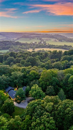 Compass Tennessee on Instagram: "Say hello to one of the most captivating + thoughtfully-designed country sanctuaries in Leipers Fork. 📍✨ Hidden behind a winding half-mile paved drive, this estate feels worlds away yet is perfectly connected to the heart of Leipers Fork—just minutes from Leipers Fork Village. The property features a masterfully renovated, hand-hewn log and stone home—a blend of artistic design + modern comfort—featuring two stone fireplaces, a chef’s kitchen, and a private prim