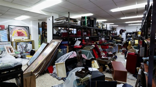 Inside Assad’s TREASURE ROOM  with signed pic of The Queen & award from FIFA