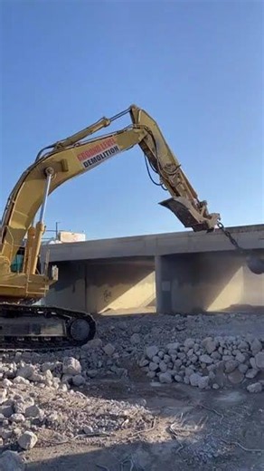 10,000 Pound Wrecking Ball attached to an excavator.