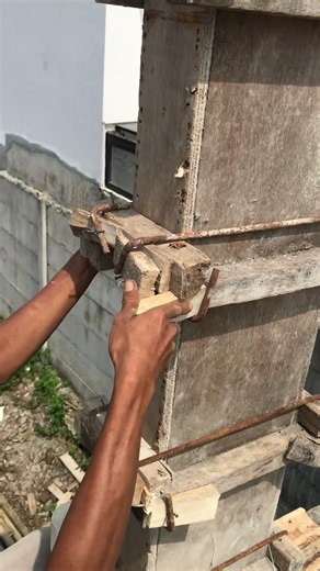 Traditional construction method: installing ties for the second-floor column formwork
