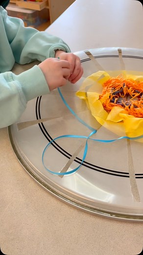 Circular weaving on a donated drumhead. Look at the fine motor practice happening while the beauty is created. All part of a collaborative art installation in @somervillepublicschools. #weaving #circularweaving #sensoryactivity #sensoryplayideas #finemotoractivity | The Beautiful Stuff Project